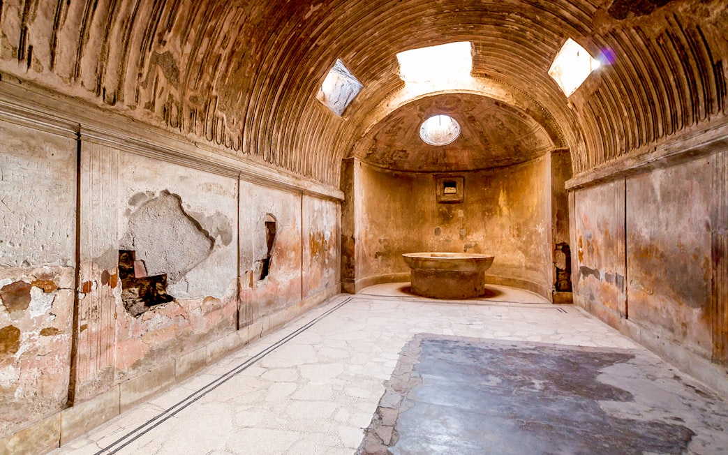 Ancient bathhouse interior in Pompeii on a 2-hour private guided tour.