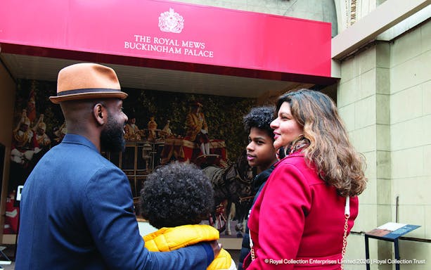 Visitors outside the Royal Mews at Buckingham Palace, London.