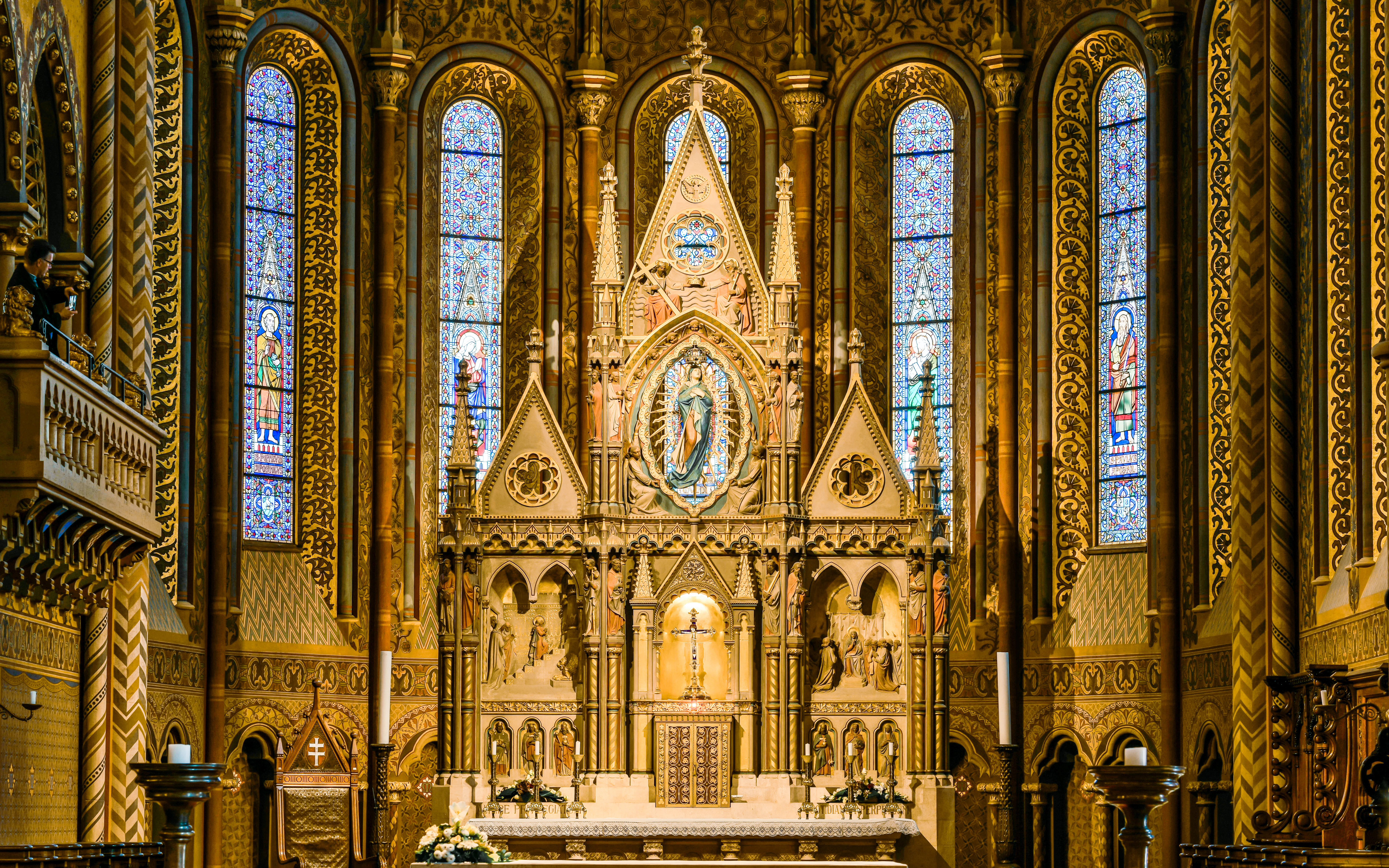 Altar of Matthias Church with ornate carvings and stained glass windows, Budapest.