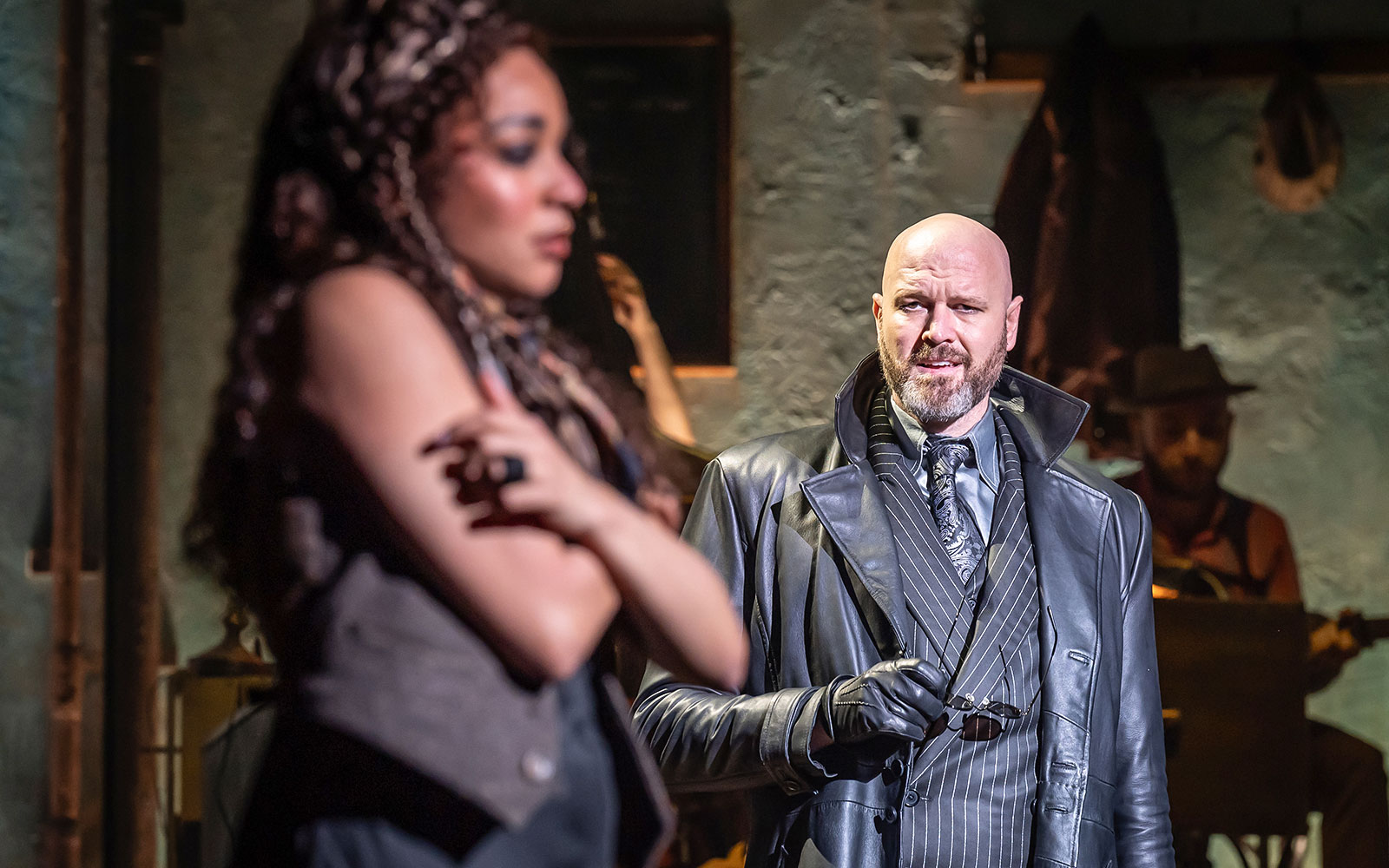 Actors performing a scene in Hadestown musical.