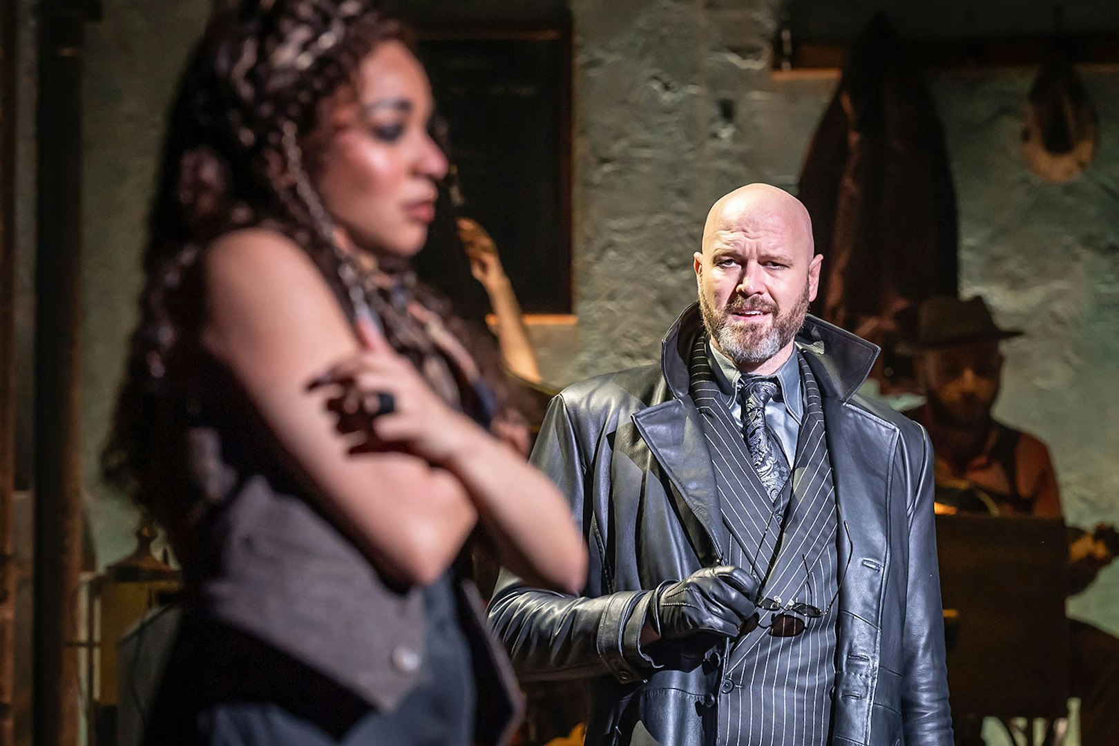 Actors performing a scene in Hadestown musical.