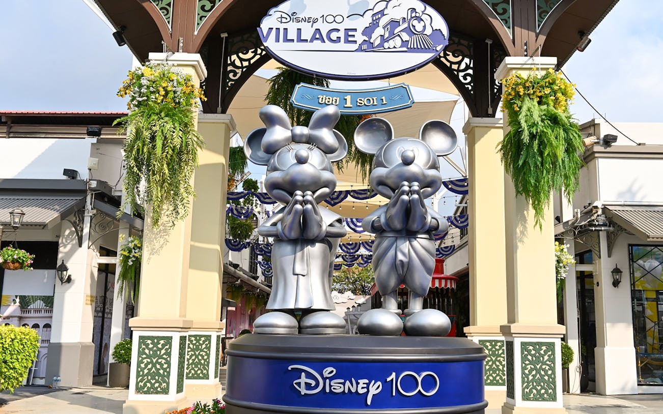 Disney 100 Village entrance with Mickey and Minnie statues at Asiatique.