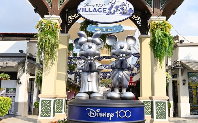 Disney 100 Village entrance with Mickey and Minnie statues at Asiatique.