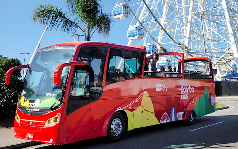 Rio de Janeiro hop-on hop-off bus near Ferris wheel.