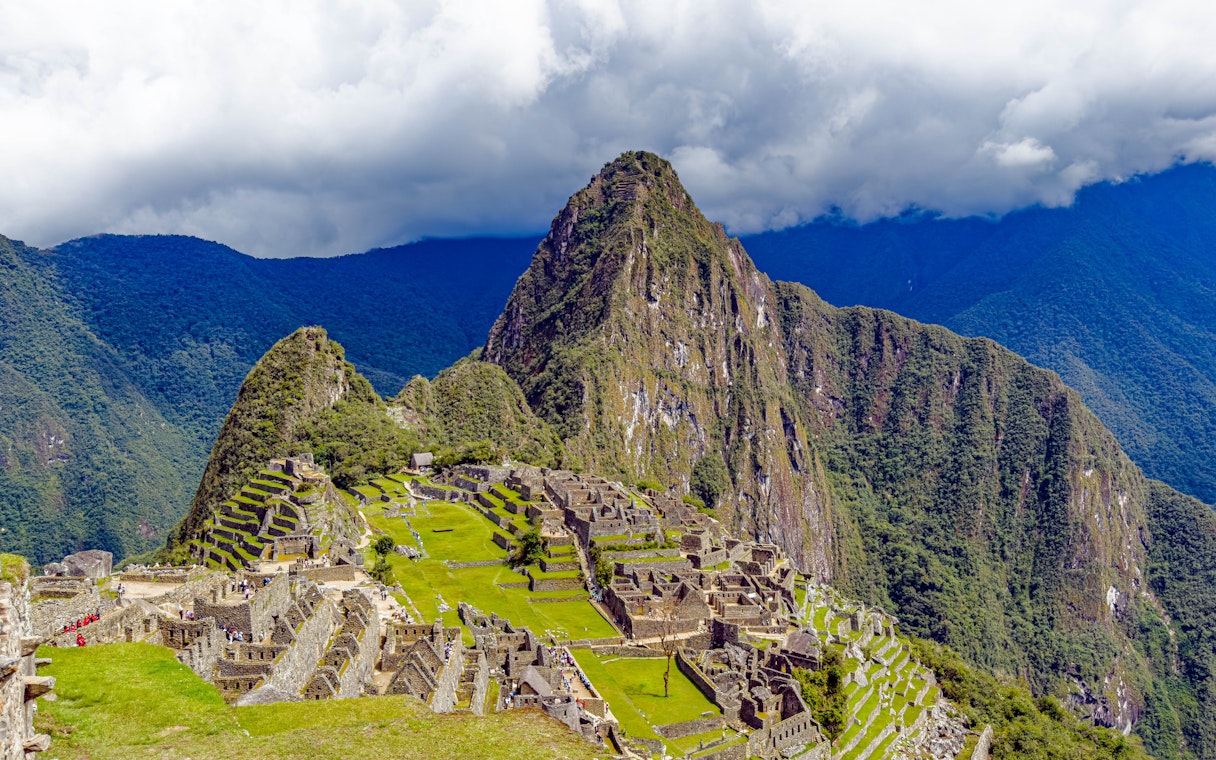 Aerial view of Machu Picchu ruins with Huayna Picchu mountain in Peru.