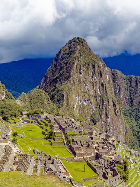 Aerial view of Machu Picchu ruins with Huayna Picchu mountain in Peru.