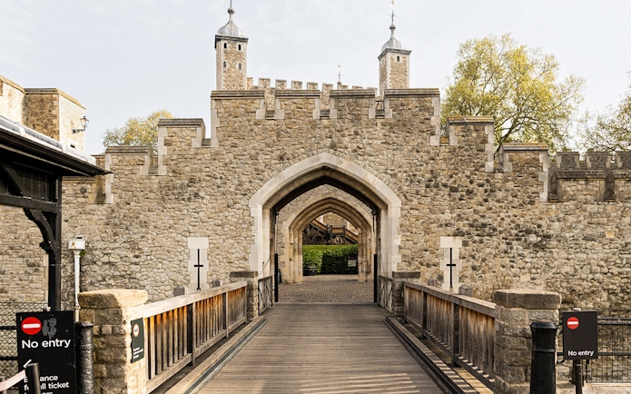 Entrance to the historic Tower of London, early morning tour setting.