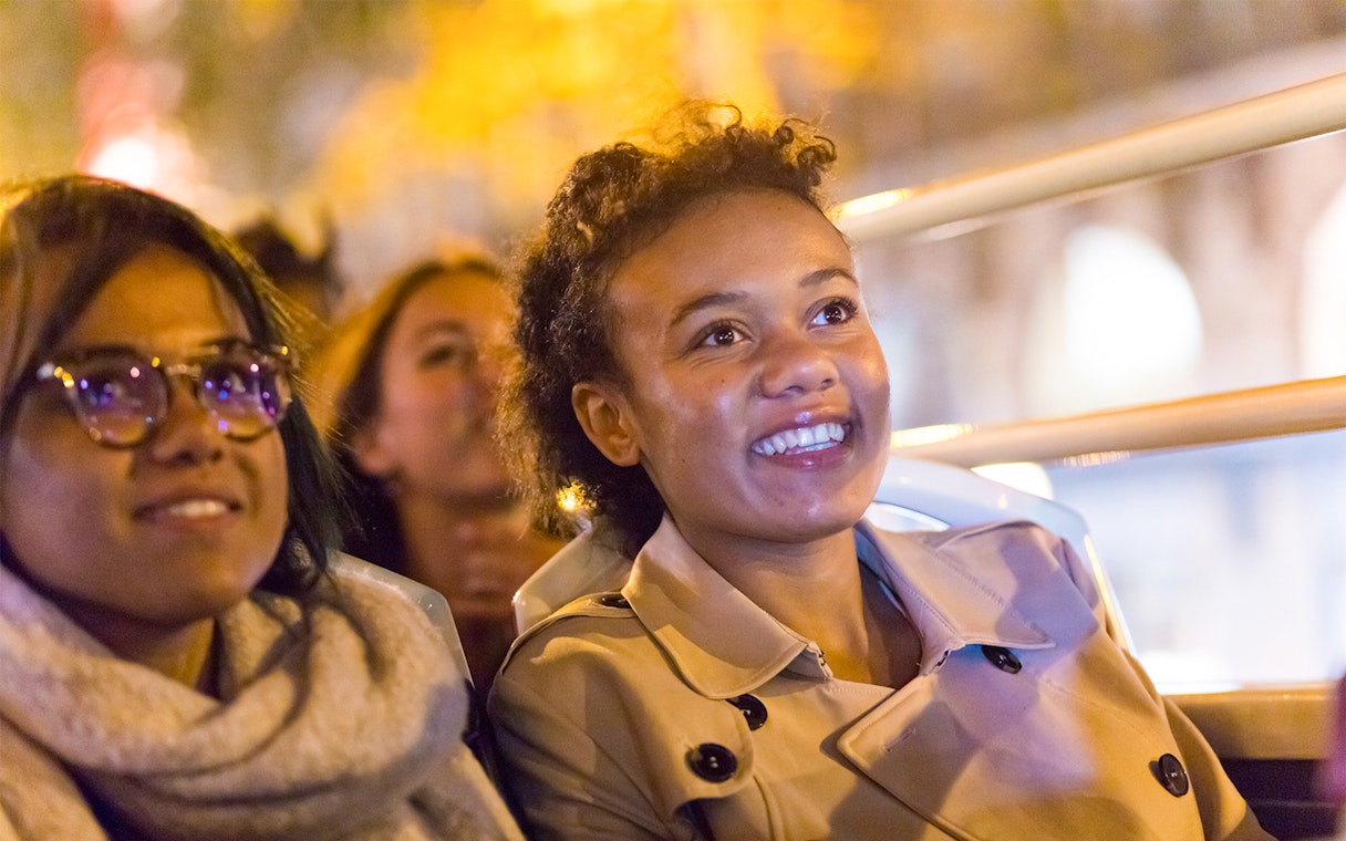 Passengers enjoying the Big Bus Paris Panoramic Night Tour.