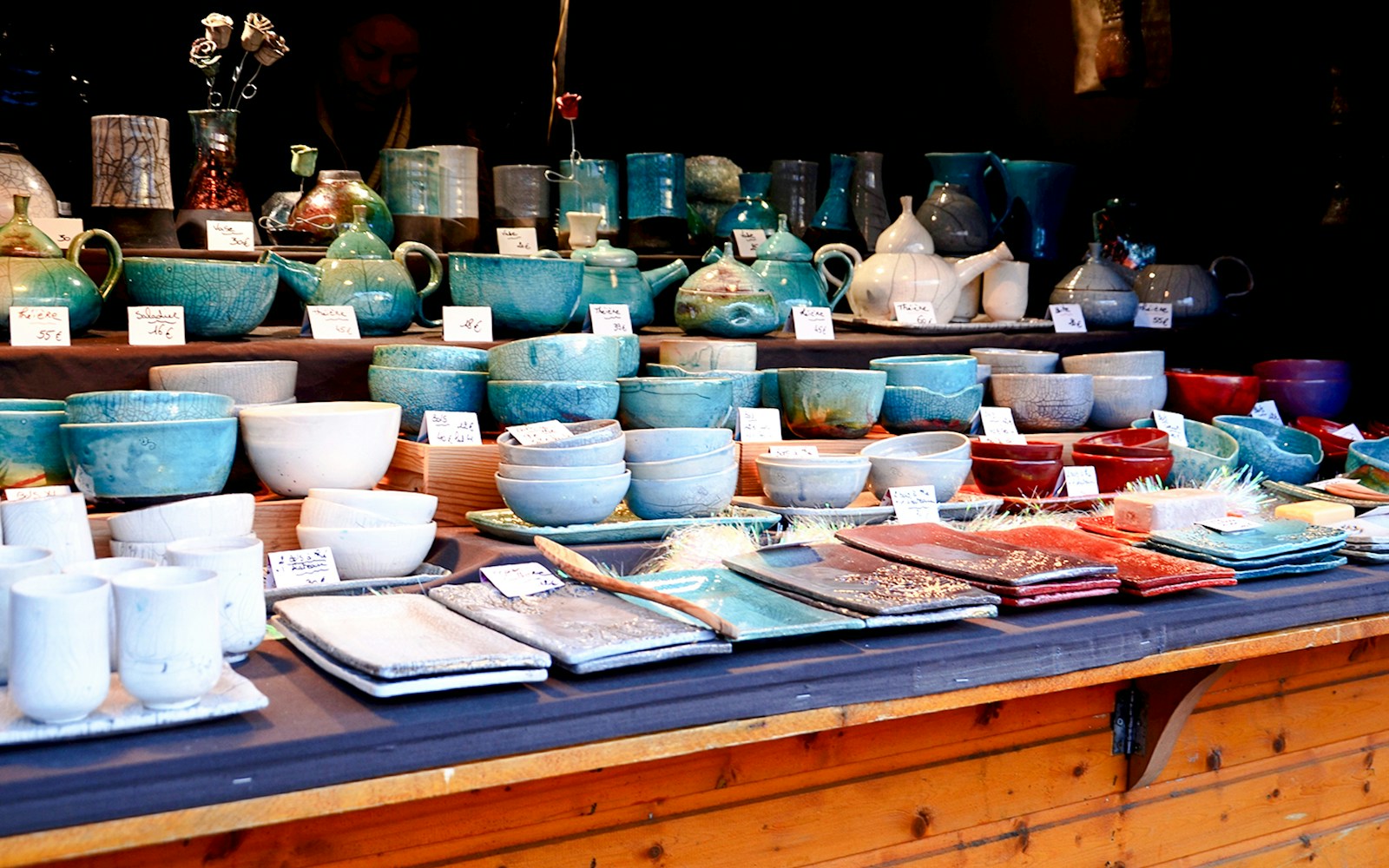 Handcrafted Finnish ceramics displayed at a market stall in Finland.