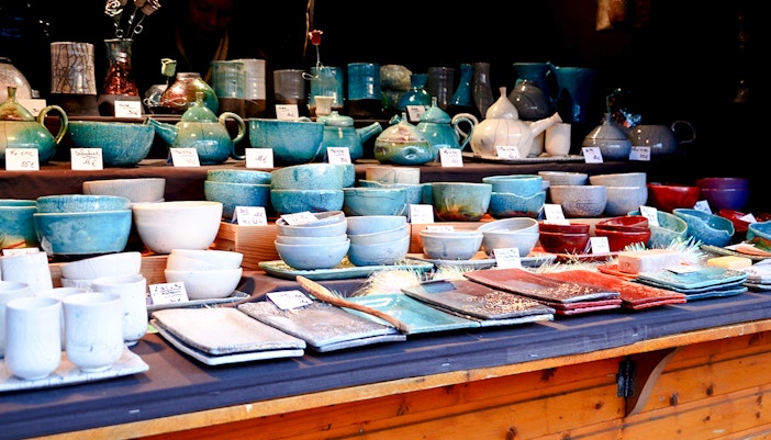 Handcrafted Finnish ceramics displayed at a market stall in Finland.