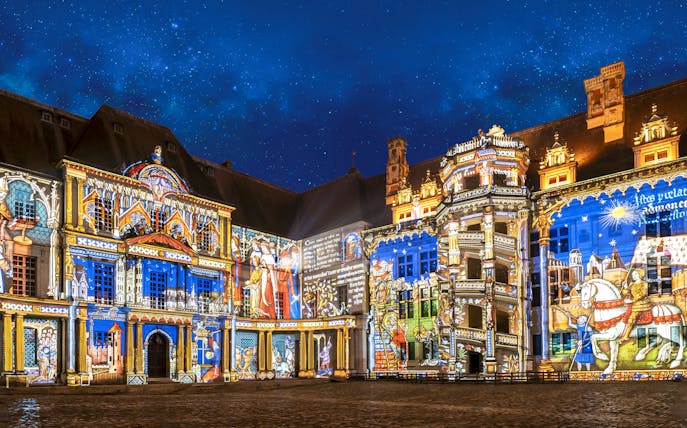 Sound and Light Show at Royal Château of Blois with illuminated historic scenes.