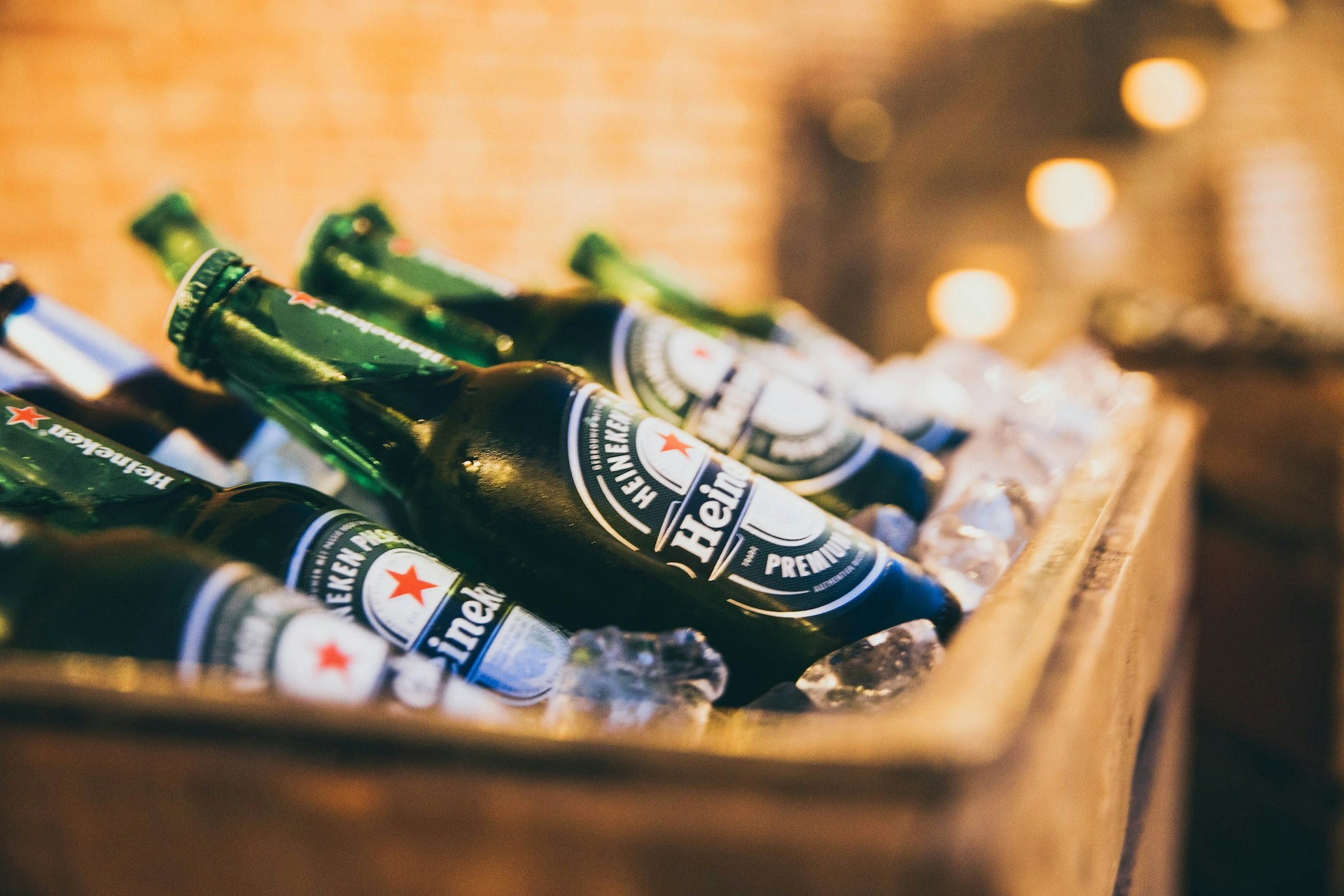Heineken bottles on ice at Amsterdam Heineken shop.