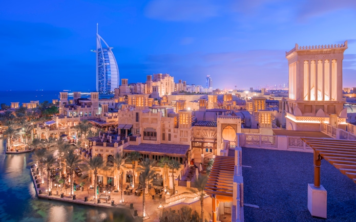 Madinat Jumeirah at night with Burj Al Arab in the background, Dubai.