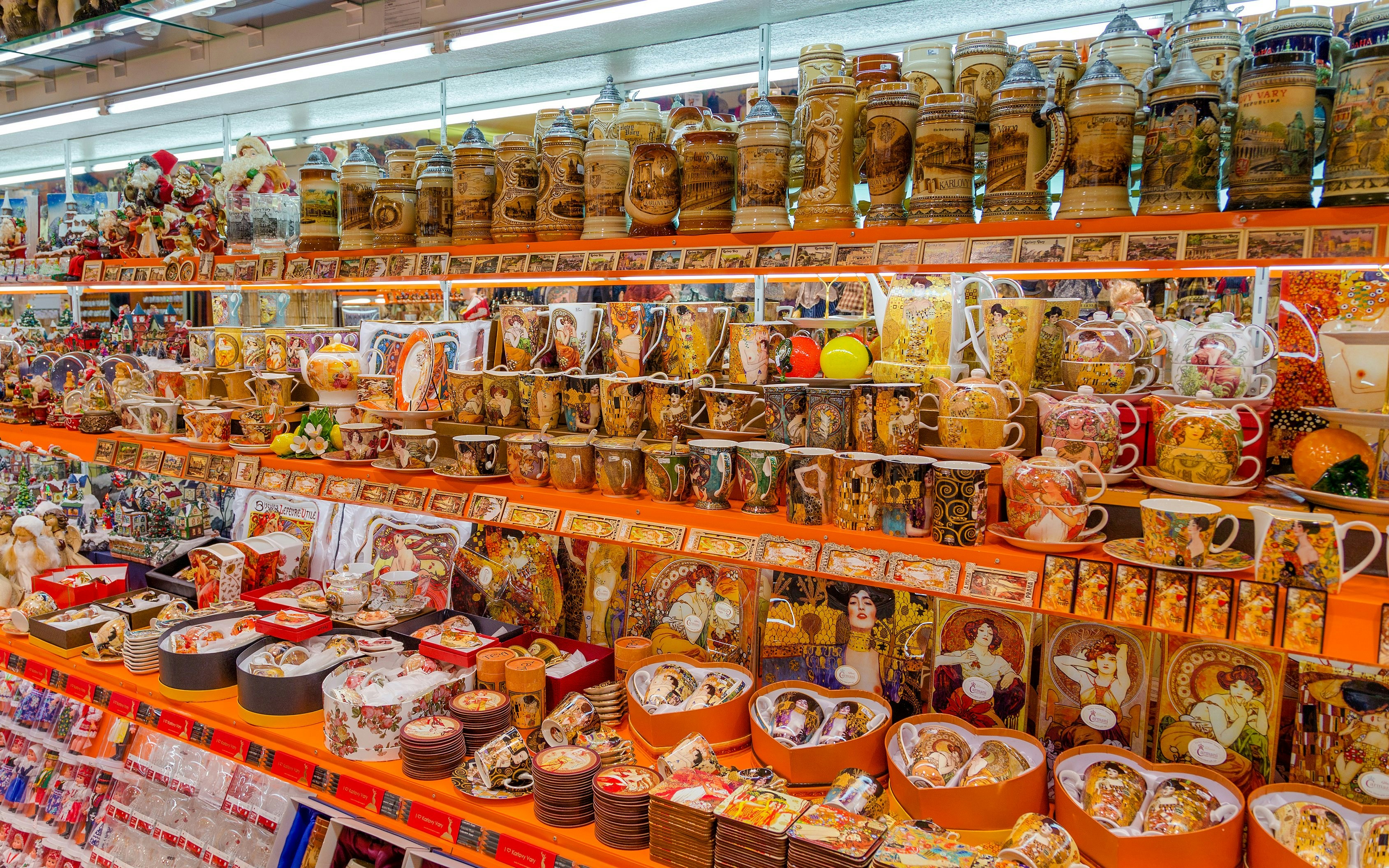Souvenir shop shelves with mugs and steins in Karlovy Vary.