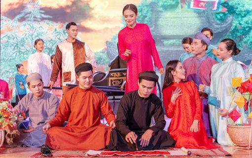 Performers in traditional Ao Dai costumes during a cultural show in Da Nang.