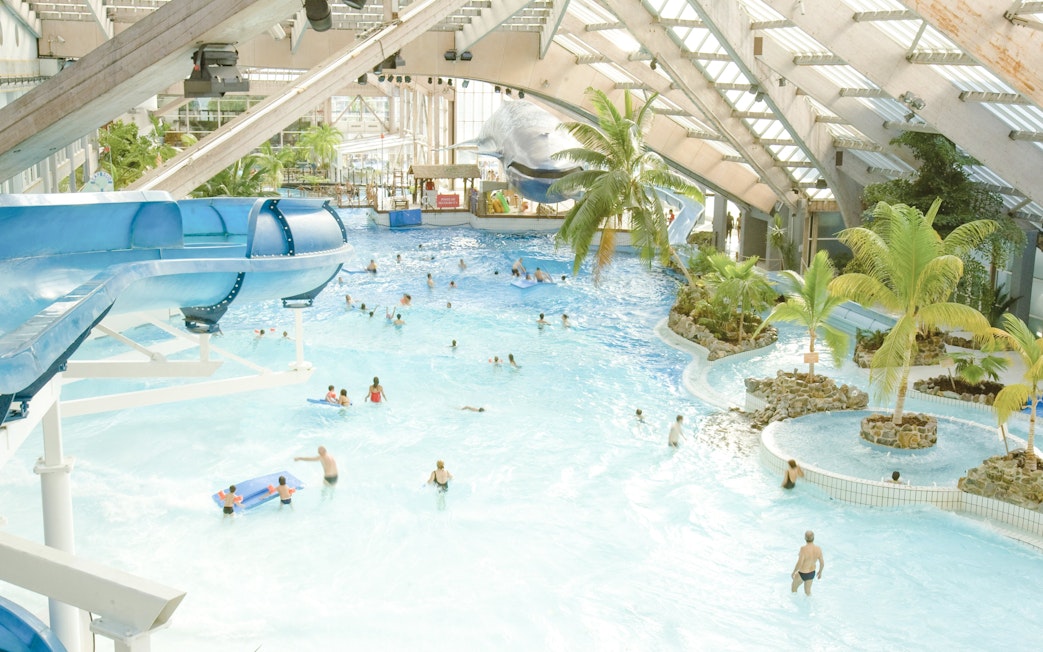 Indoor water park with slides and wave pool at Aquaboulevard de Paris.