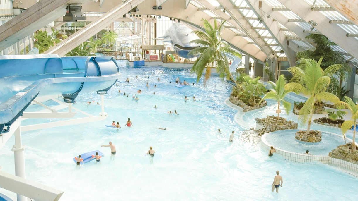 Indoor water park with slides and wave pool at Aquaboulevard de Paris.