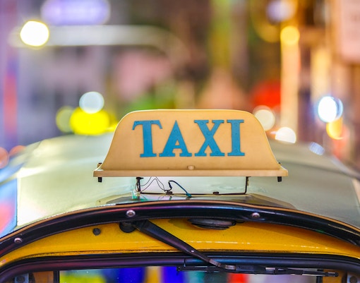 Tiger Park Pattaya entrance with parked taxi, Thailand.