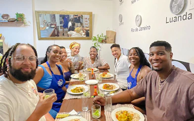 Participants enjoying a Brazilian cooking class meal in Copacabana, Rio de Janeiro.