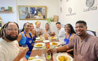 Participants enjoying a Brazilian cooking class meal in Copacabana, Rio de Janeiro.