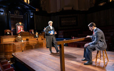 Courtroom scene from "Witness for the Prosecution" performance with actors in legal roles.