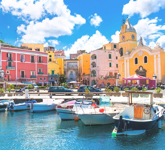 Boats docked in the harbor of colorful Procida Island, Campania, Italy.