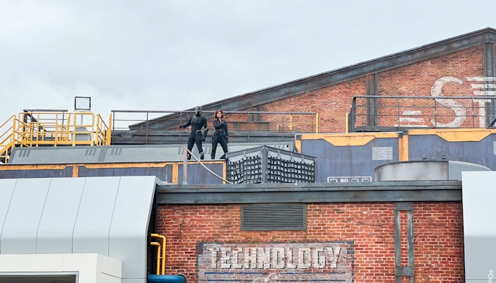 Avengers characters on rooftop during Disneyland Paris show.