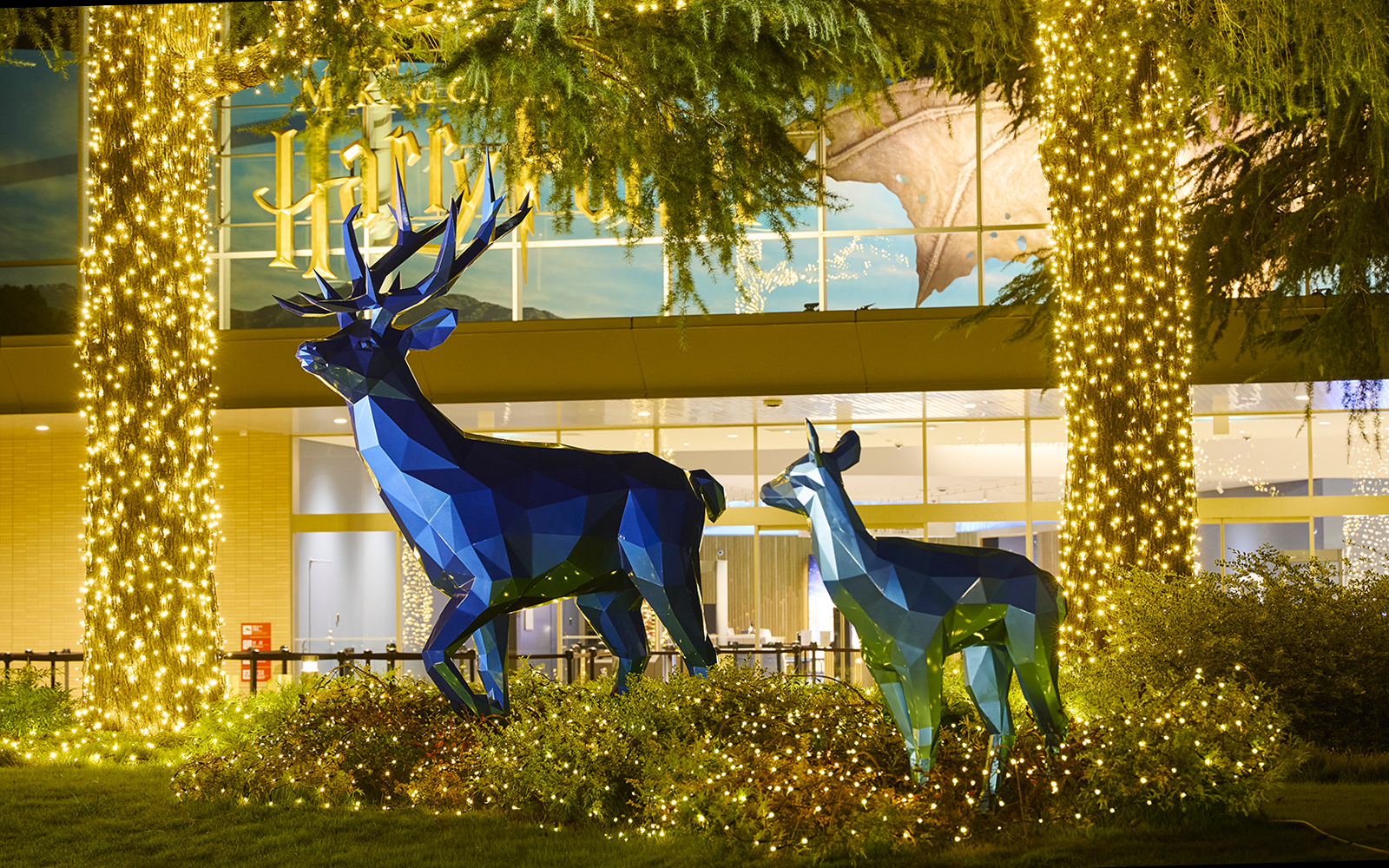 Blue stag and doe sculptures with Christmas lights at Harry Potter Studio Tour Tokyo.