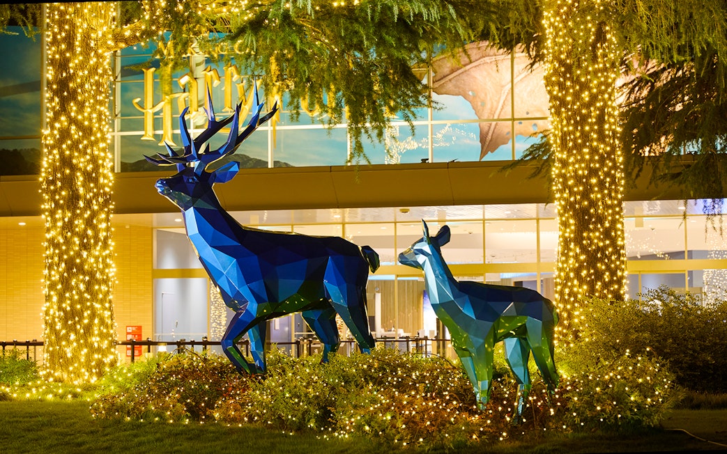 Blue stag and doe sculptures with Christmas lights at Harry Potter Studio Tour Tokyo.