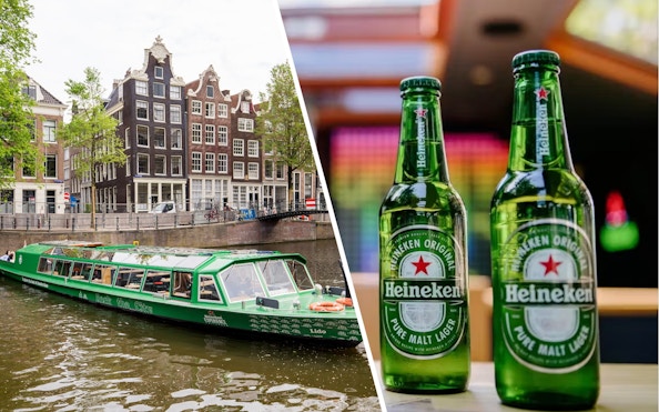 Heineken cruise boat on Amsterdam canal with Heineken bottles.