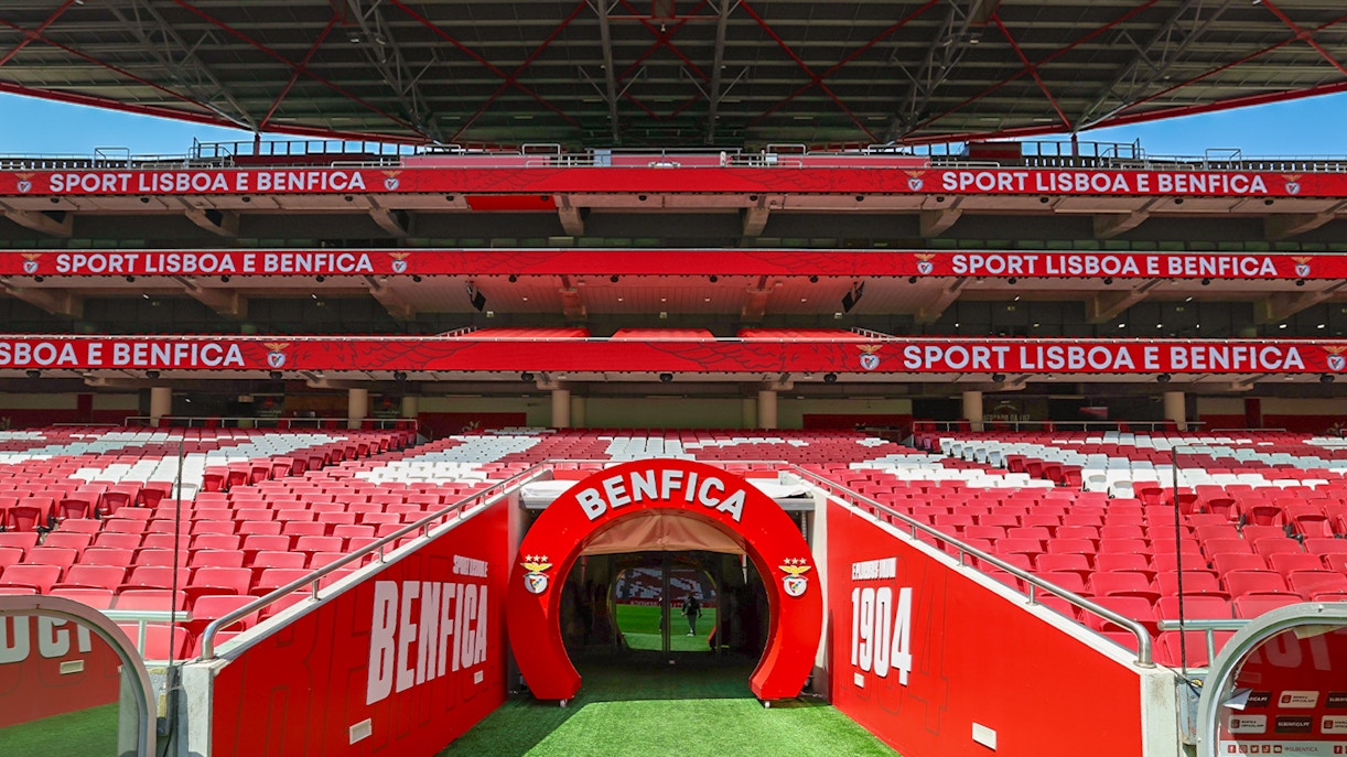 Benfica Stadium players tunnel with team logos and red walls in Lisbon, Portugal.
