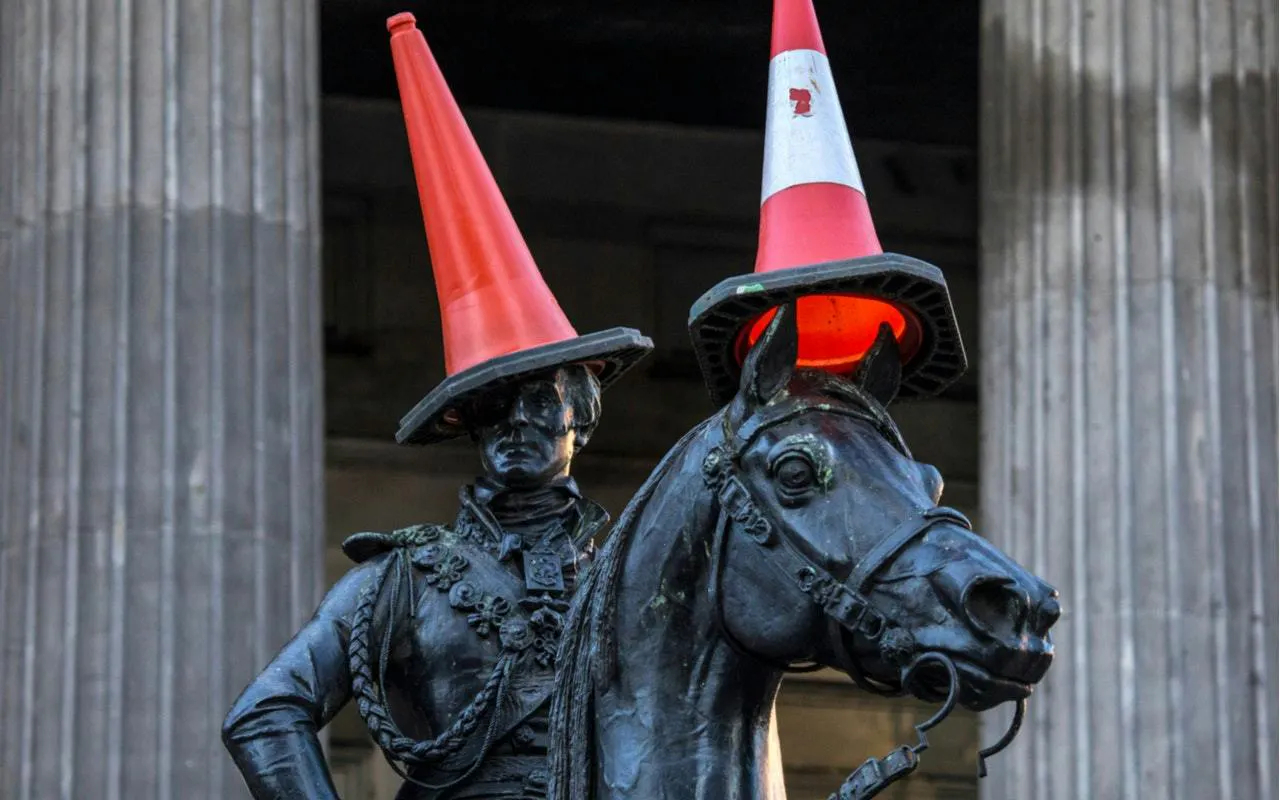 Equestrian statue with traffic cones on head, Glasgow city exploration game.
