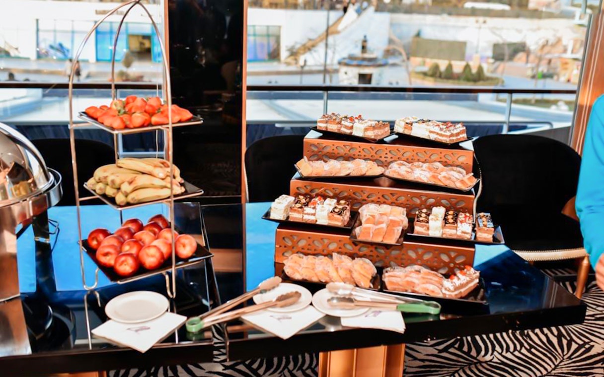 Dessert and fruit buffet on Nile River dinner cruise with pastries and fresh produce.