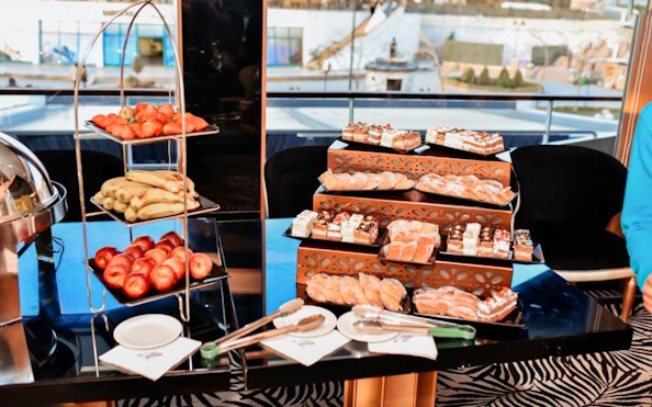 Dessert and fruit buffet on Nile River dinner cruise with pastries and fresh produce.