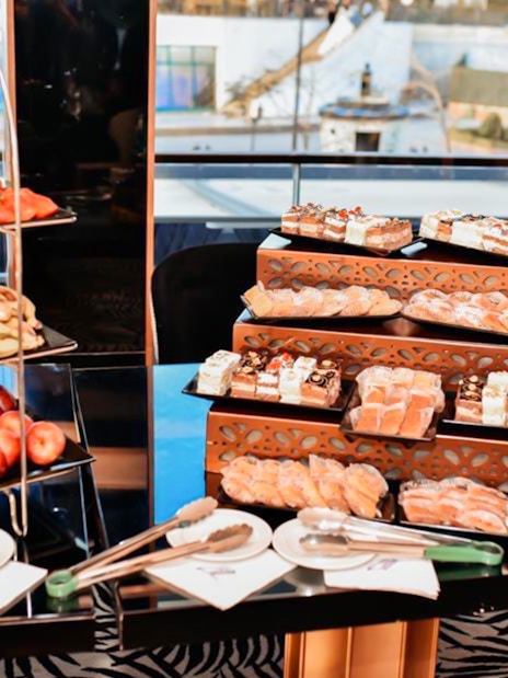 Dessert and fruit buffet on Nile River dinner cruise with pastries and fresh produce.