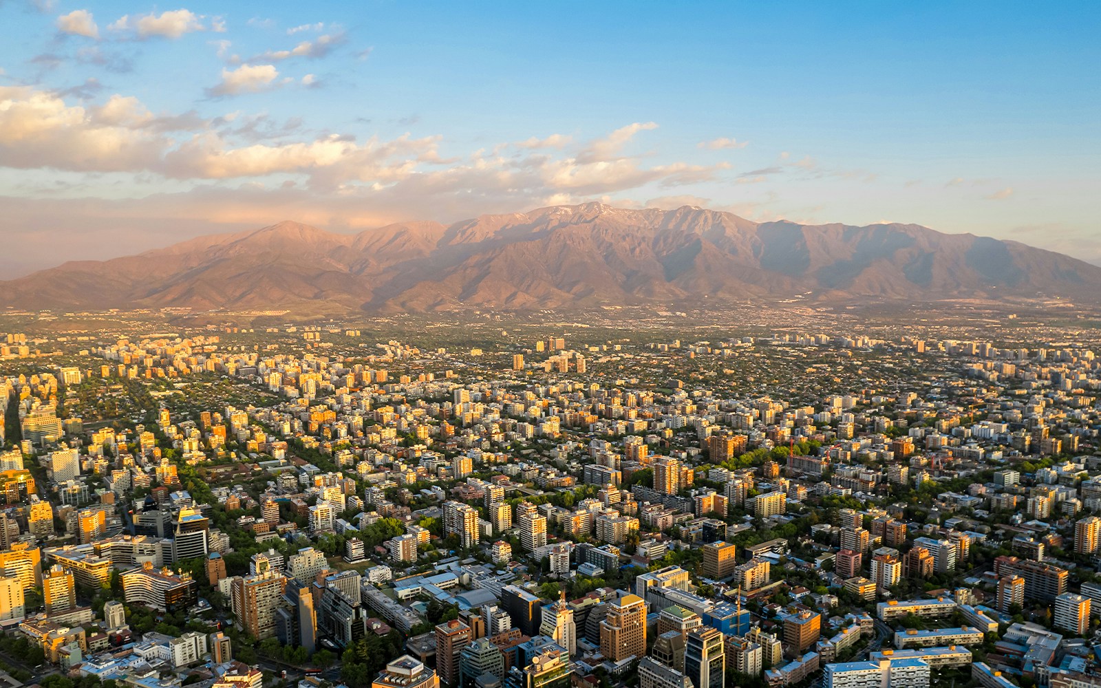 Aerial view of Santiago cityscape with Andes mountains from Sky Costanera, Chile.