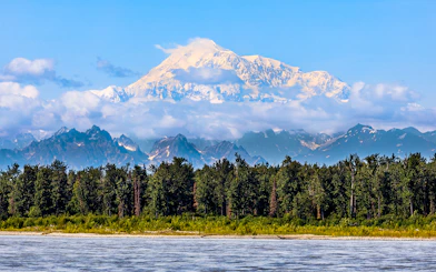 Denali mountain view with forest and river, Alaska Railroad tour.