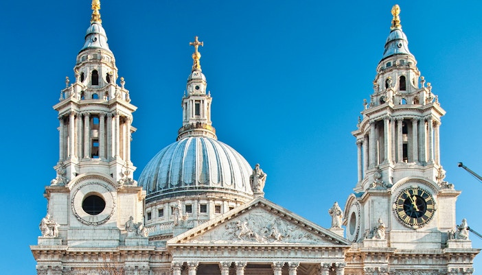 St Paul's Cathedral West Towers and dome under clear blue sky, London.