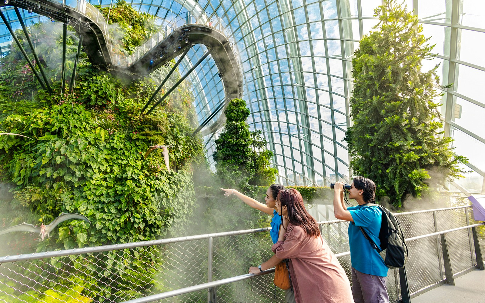 Visitors exploring Jurassic World exhibit at Cloud Forest, Gardens by the Bay, Singapore.