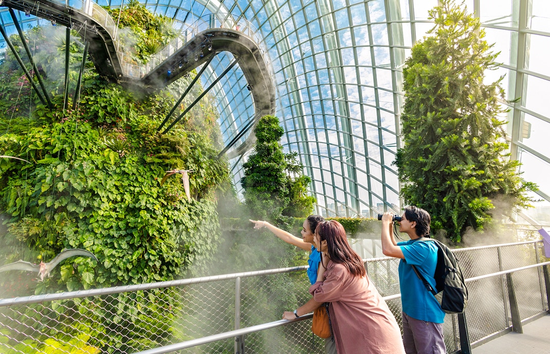 Visitors exploring Jurassic World exhibit at Cloud Forest, Gardens by the Bay, Singapore.