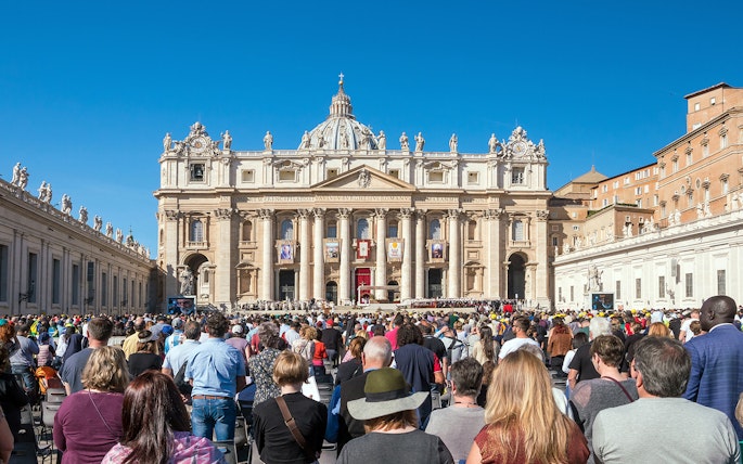 Tourists gathered at St. Peter's Basilica in Vatican City, Rome, Italy.