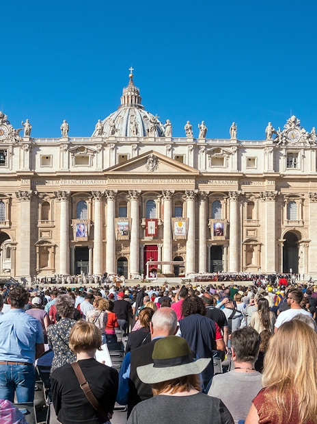 Tourists gathered at St. Peter's Basilica in Vatican City, Rome, Italy.