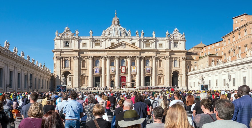 Tourists gathered at St. Peter's Basilica in Vatican City, Rome, Italy.