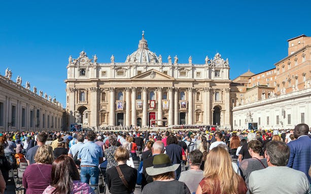 Tourists gathered at St. Peter's Basilica in Vatican City, Rome, Italy.