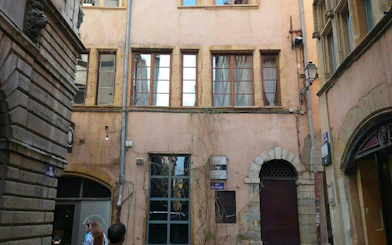 Old Lyon street with historic buildings, part of the Lyon Murder Mystery city exploration game.