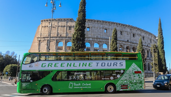 Green Line Rome hop-on hop-off passing by Colosseum