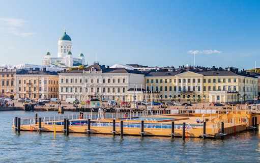 Floating sea spa at Helsinki Pool with Market Square and Helsinki Cathedral in the background.