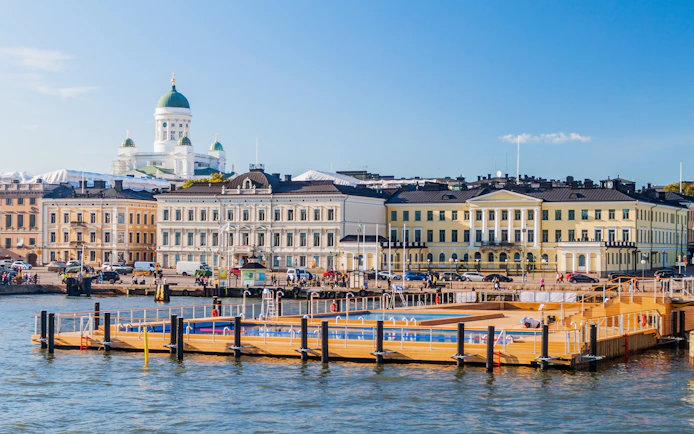 Floating sea spa at Helsinki Pool with Market Square and Helsinki Cathedral in the background.