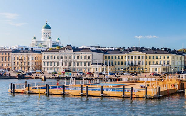 Floating sea spa at Helsinki Pool with Market Square and Helsinki Cathedral in the background.