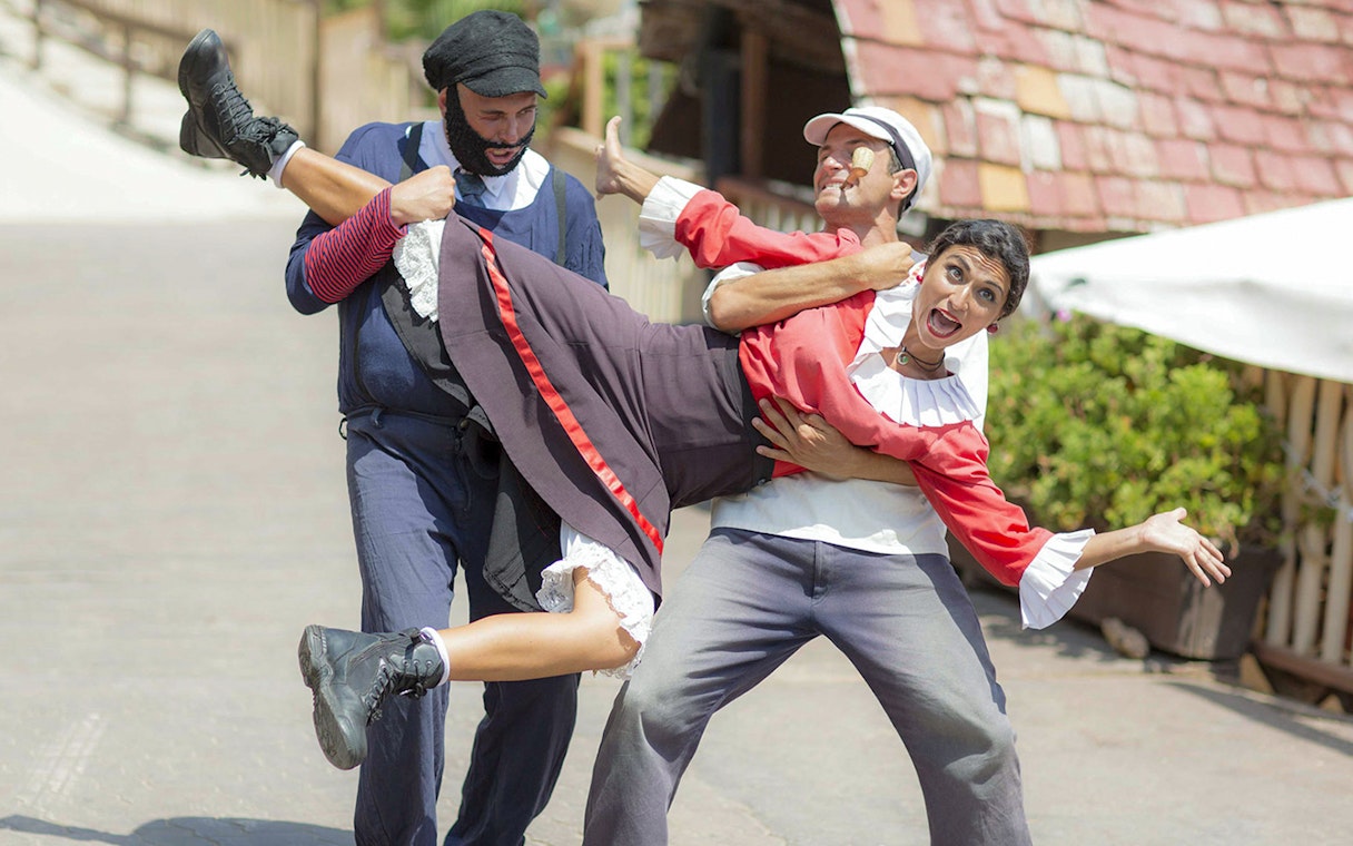 Popeye crew performing a playful scene at Popeye Village, Malta.